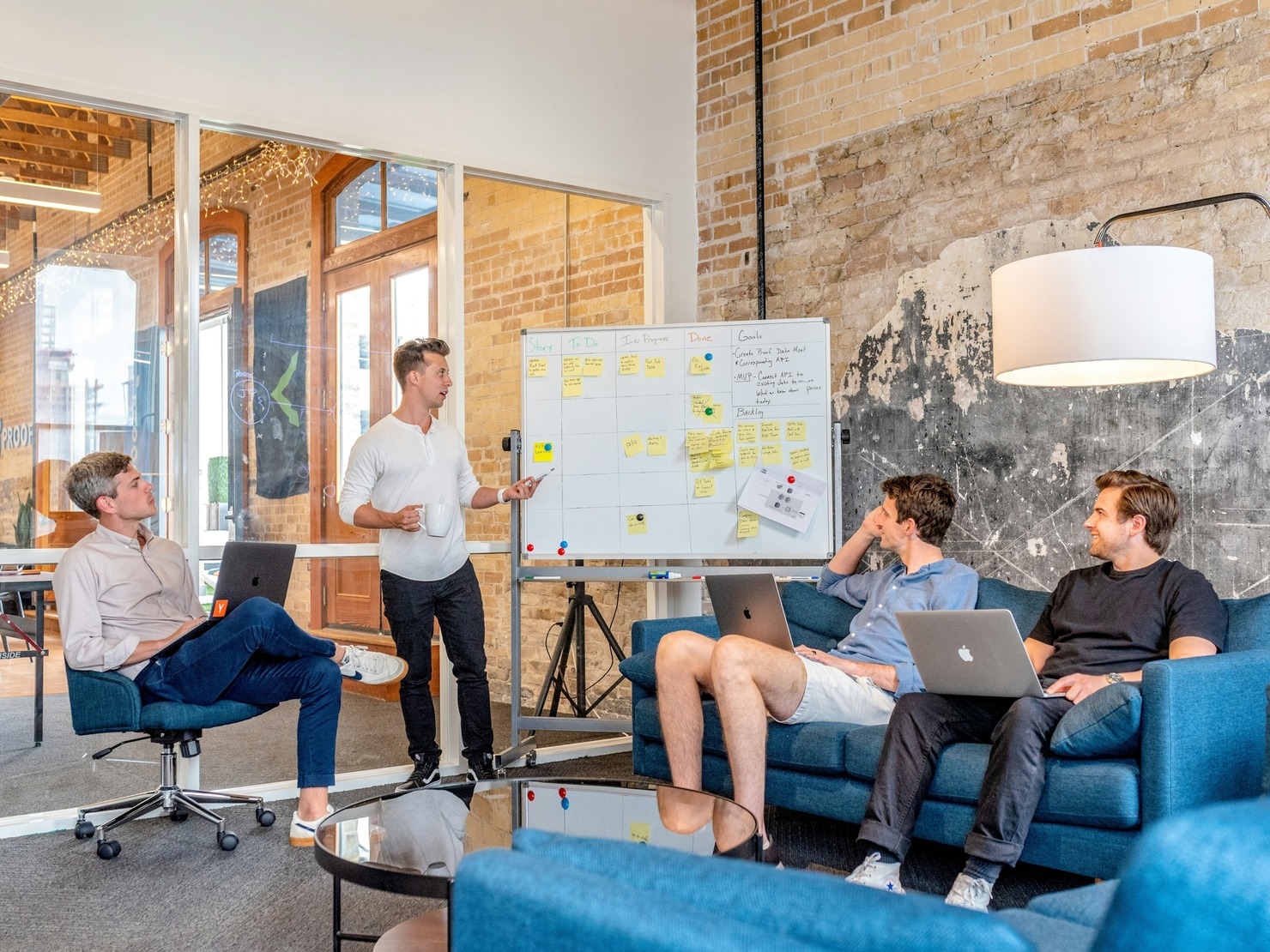 A group of businessmen analysing a competitor.