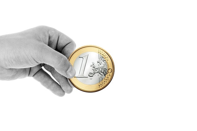 A hand with a coin