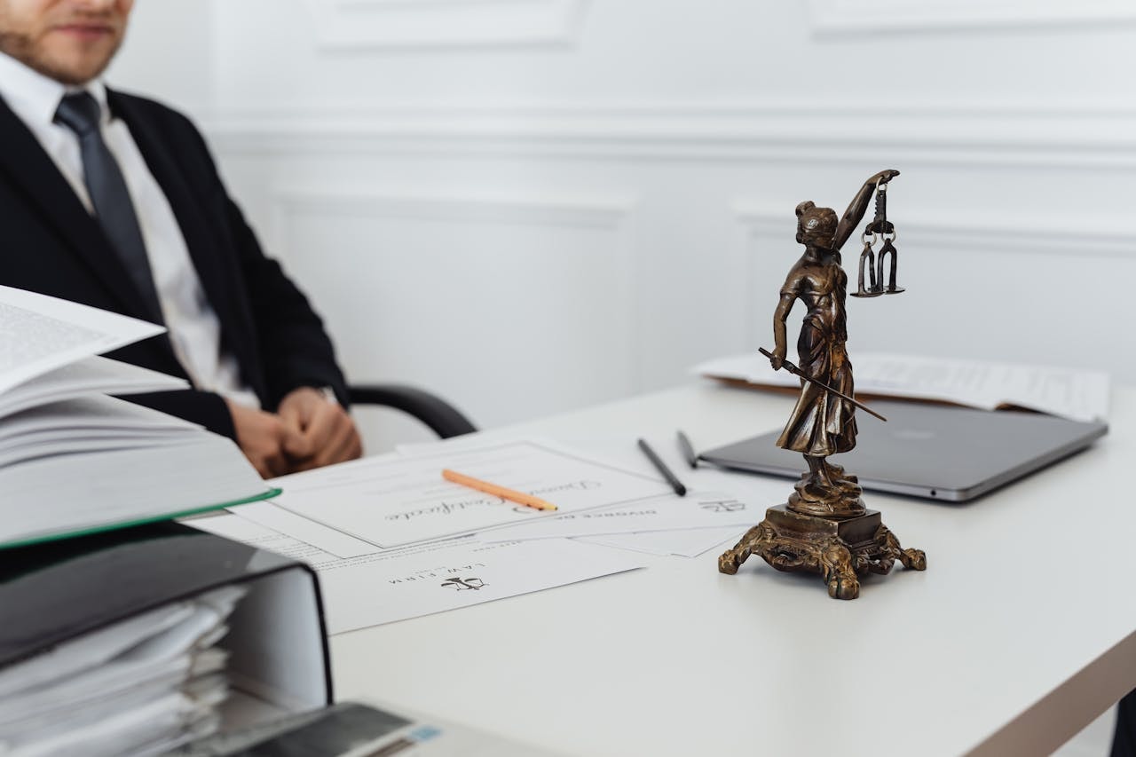 A person sitting at a desk at a law firm
