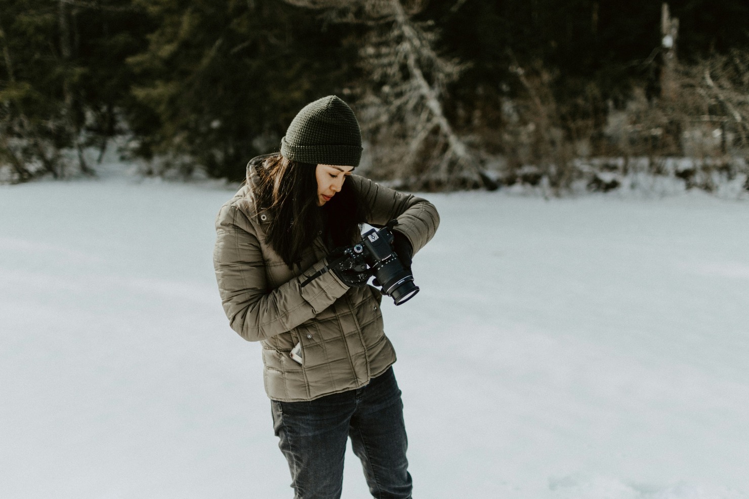 A woman making a vlog in snow.