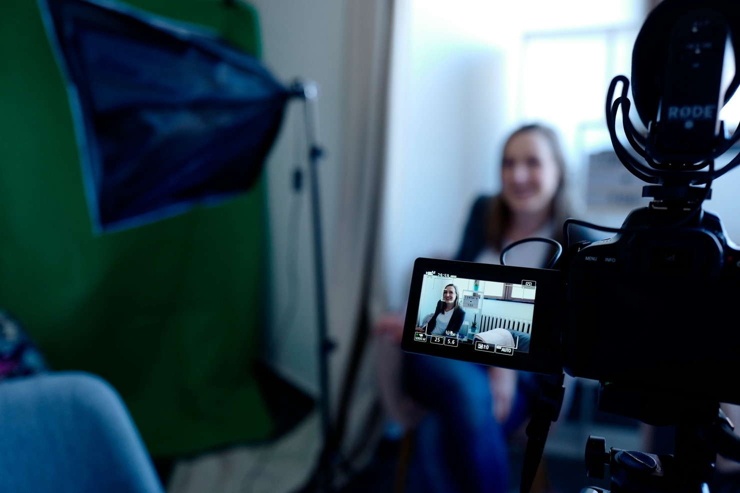 A woman recording herself talk in a vlog.