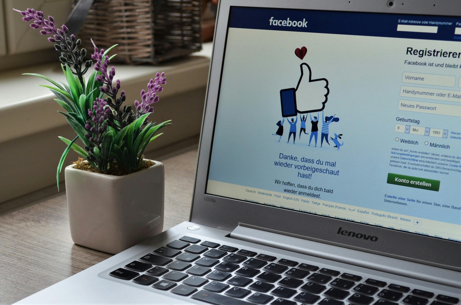 Laptop displaying Facebook's signup page.
