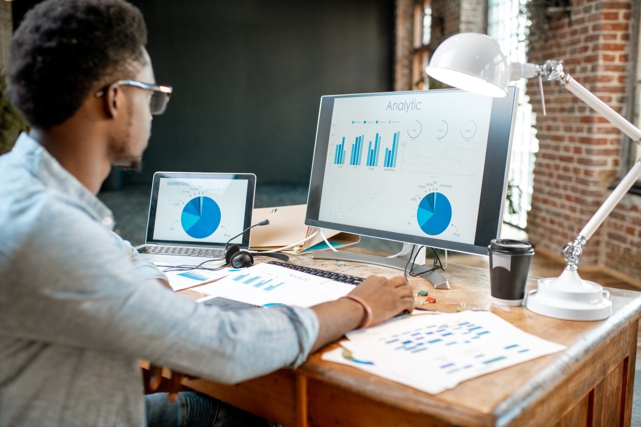 Personal trainer watching his paid ads analytics
