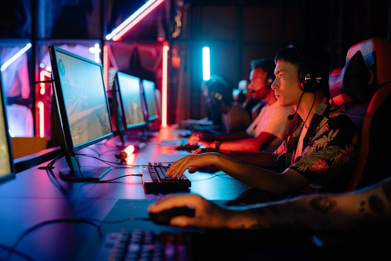 Young men playing games at esports tournament