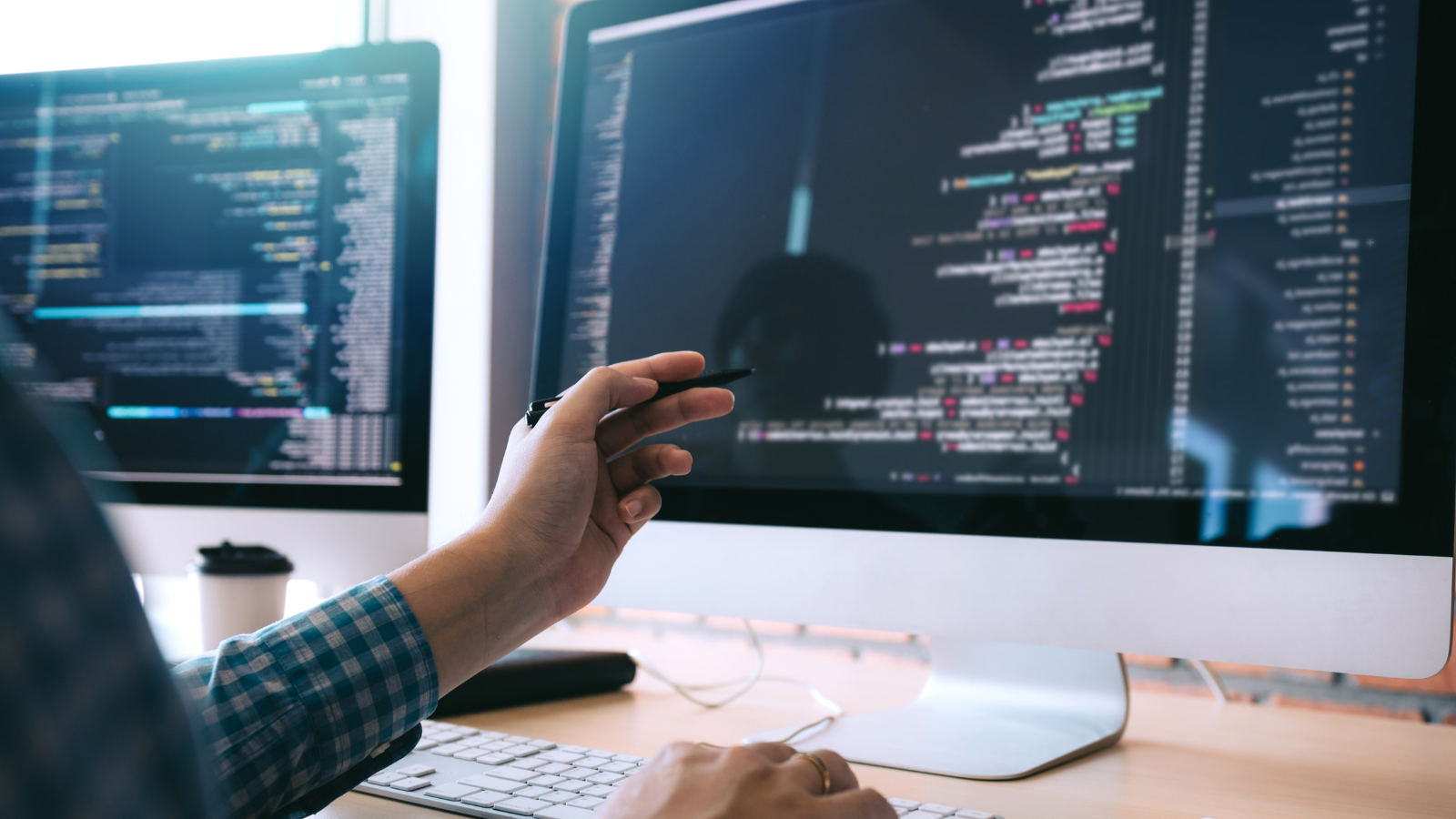 A developer working in fron of a computer - blog image