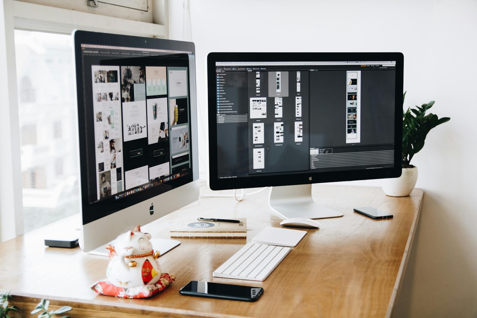 Two computers displaying graphic designs and templates