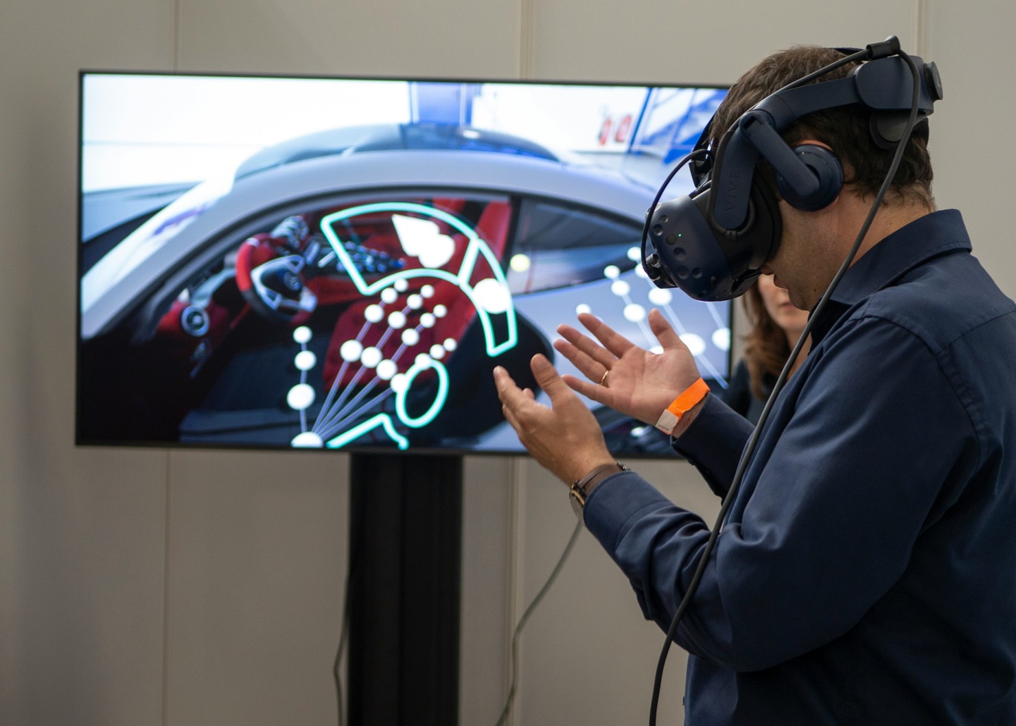 A man wearing Virtual Reality headsets.