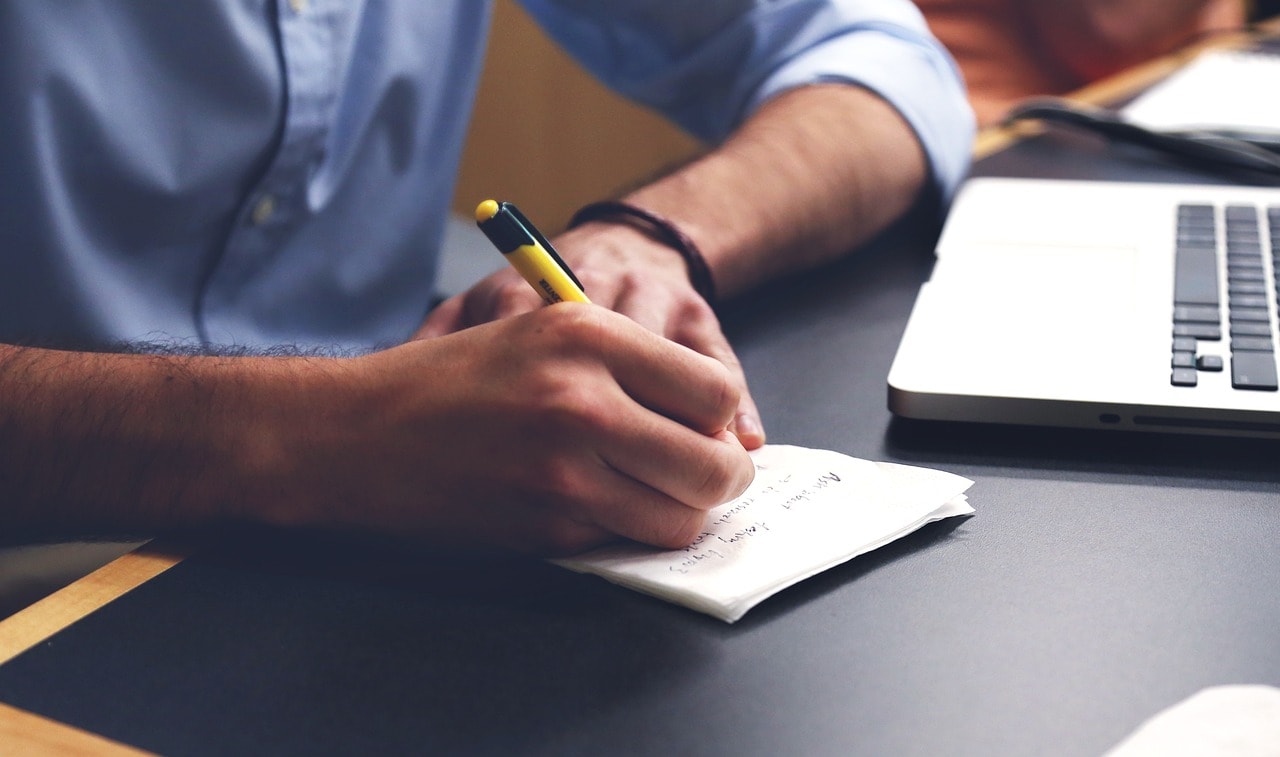 A man writing a business plan.