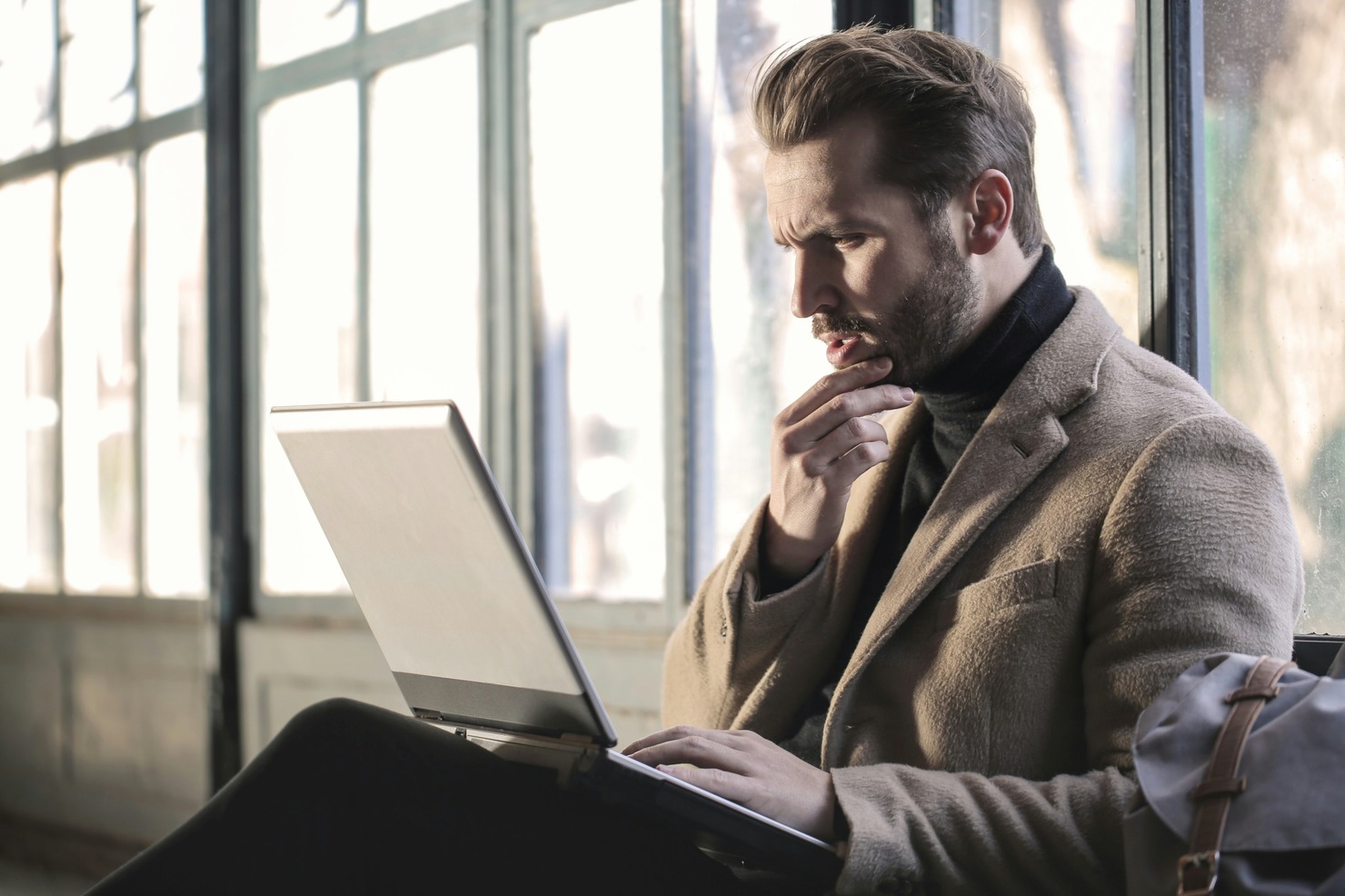 A man writing an ebook online.
