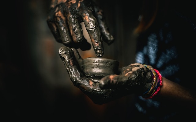 A pair of hands doing pottery.