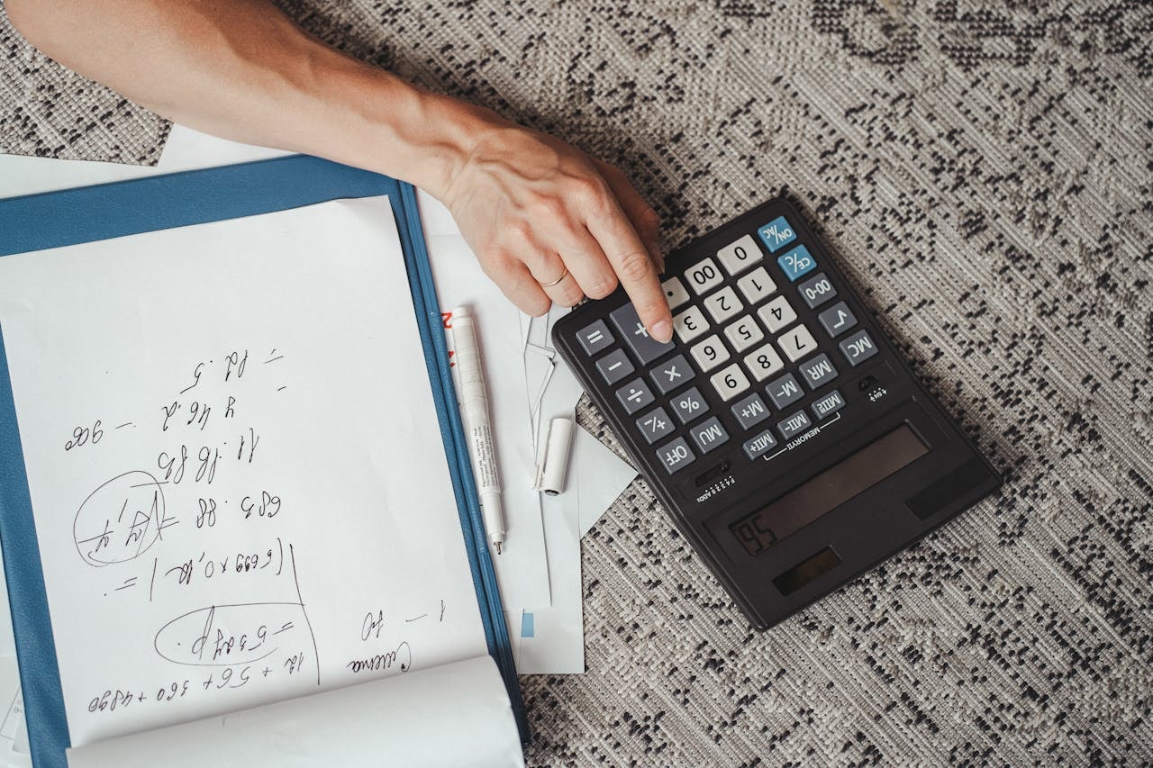 A person using a calculator