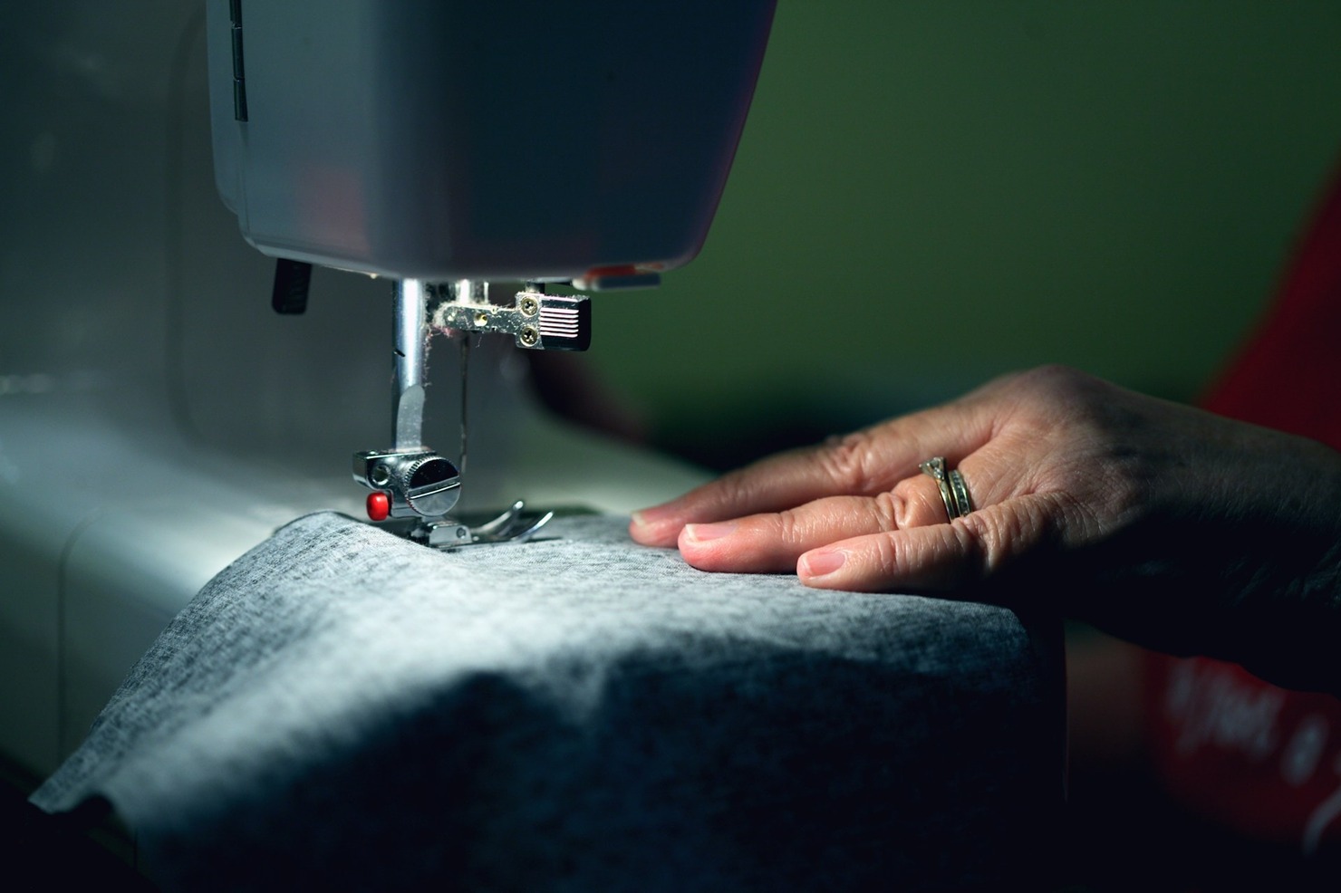 A person using a sewing machine