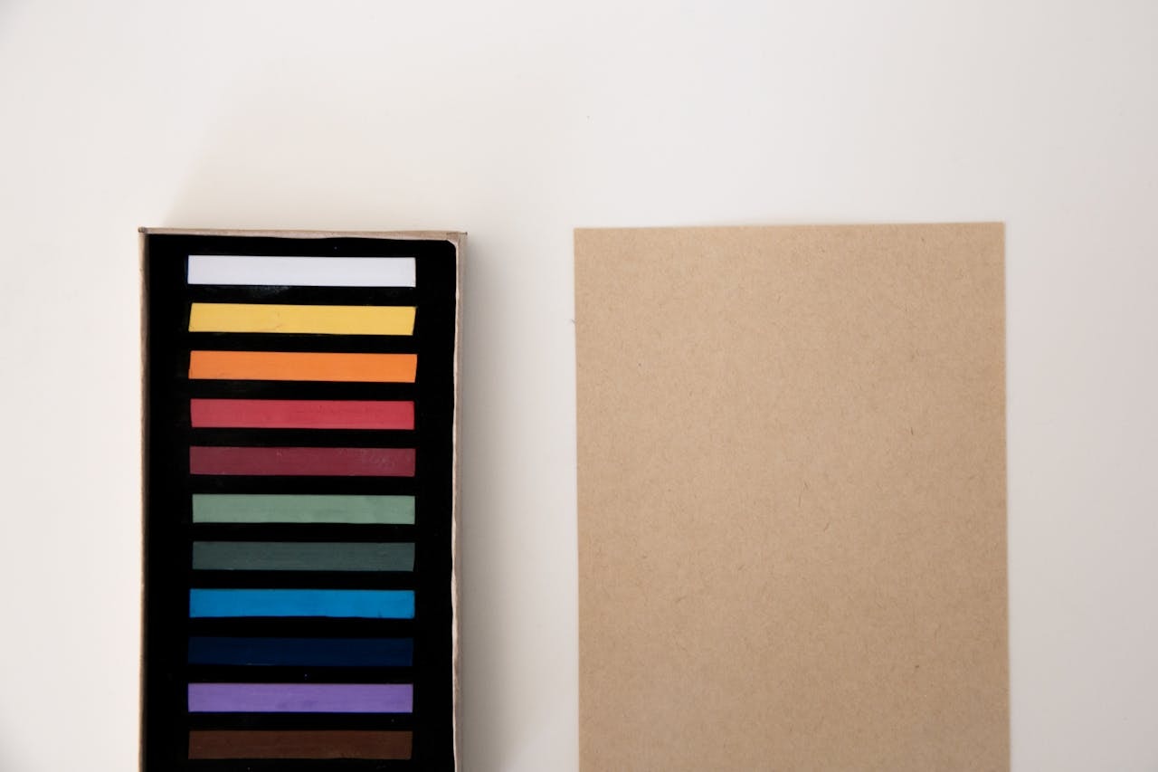 A photo of strips of colors on a black surface