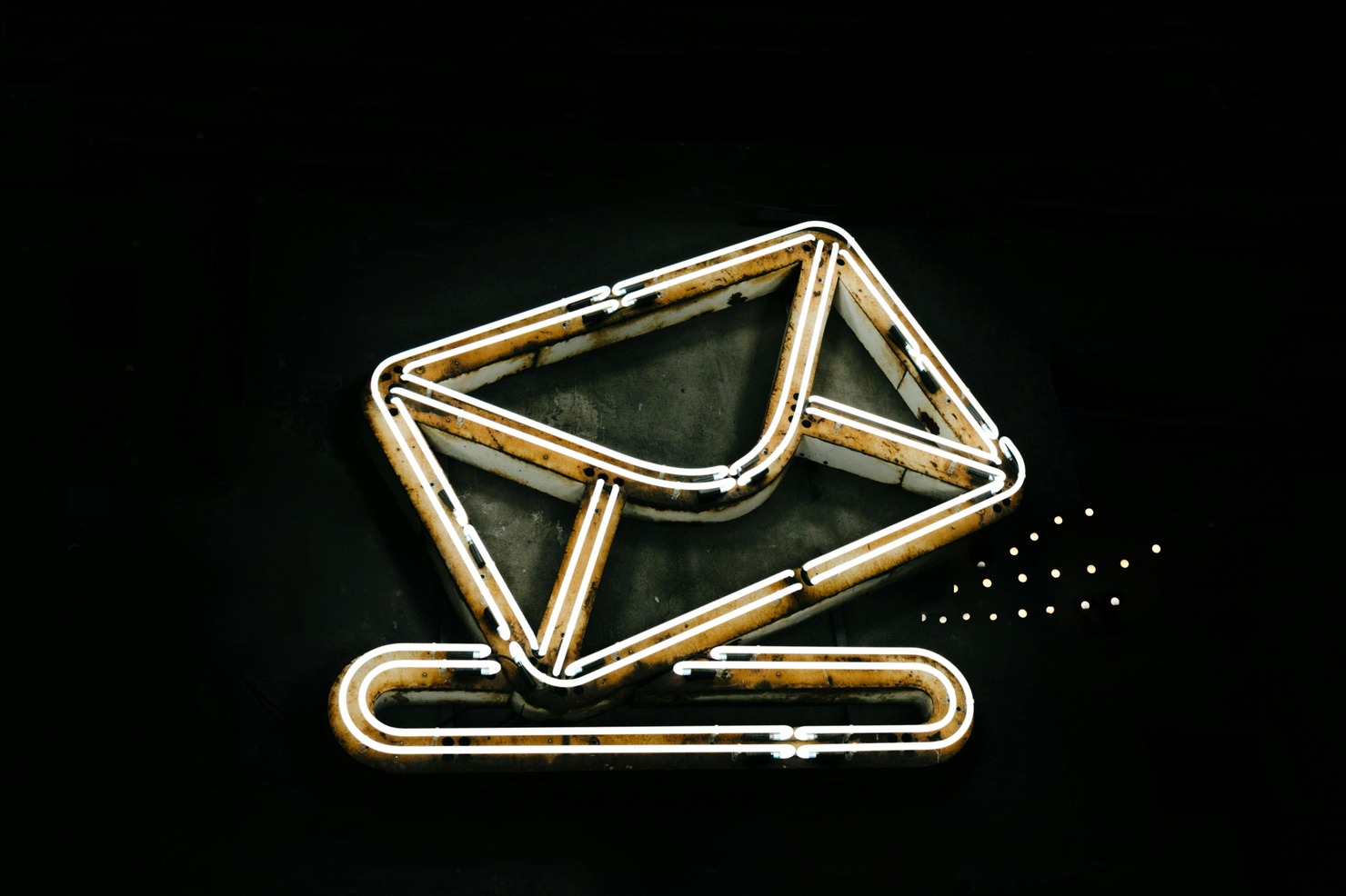 An unlit LED light shaped like an email icon.