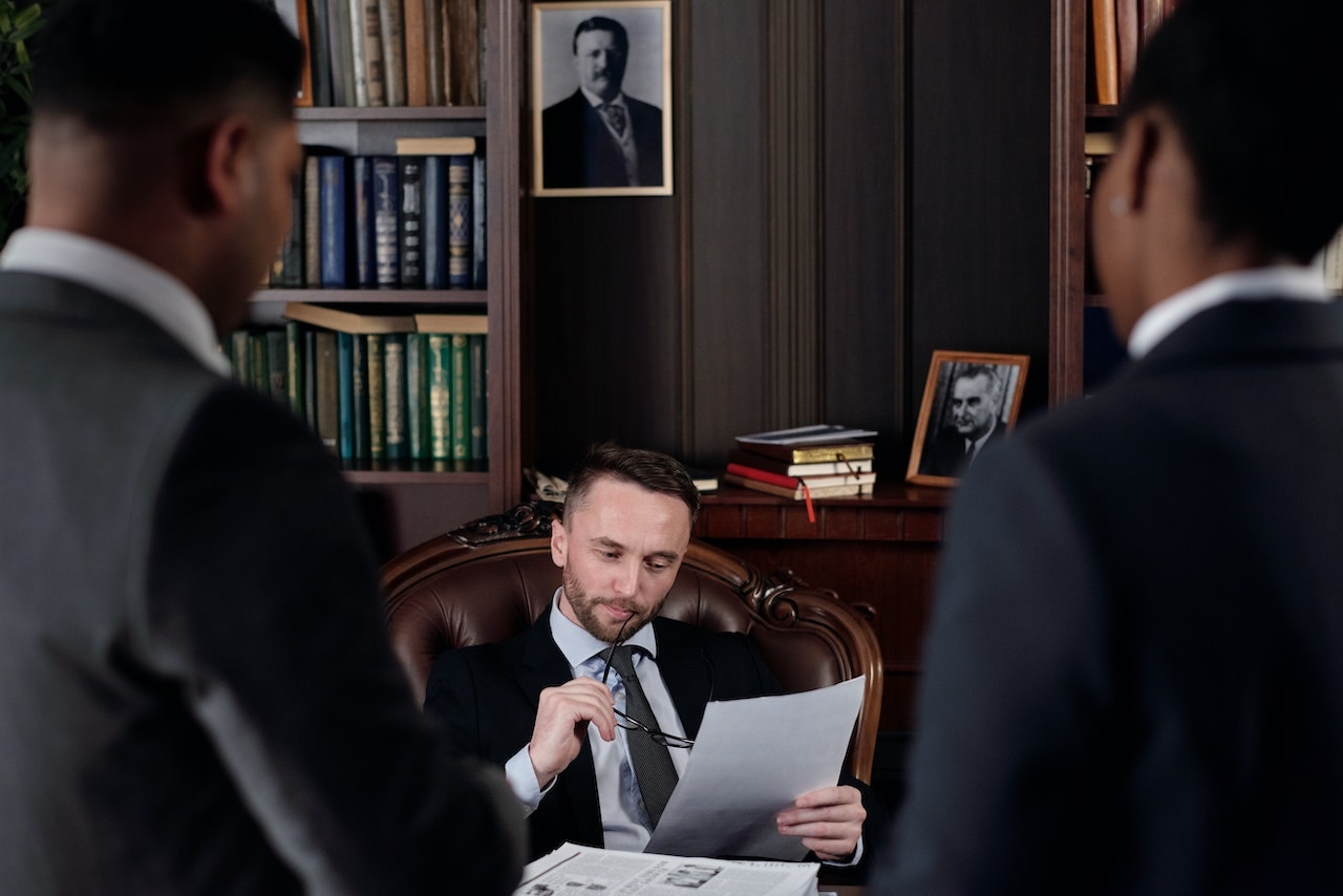 Business person consulting a lawyer