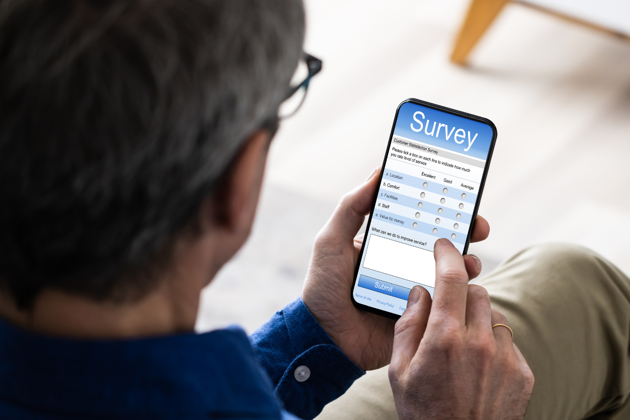 Business person filling out online form via phone.