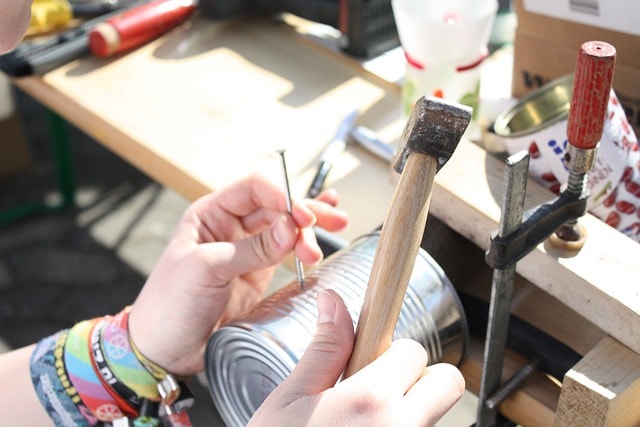 Crafting a handmade upcycled can.