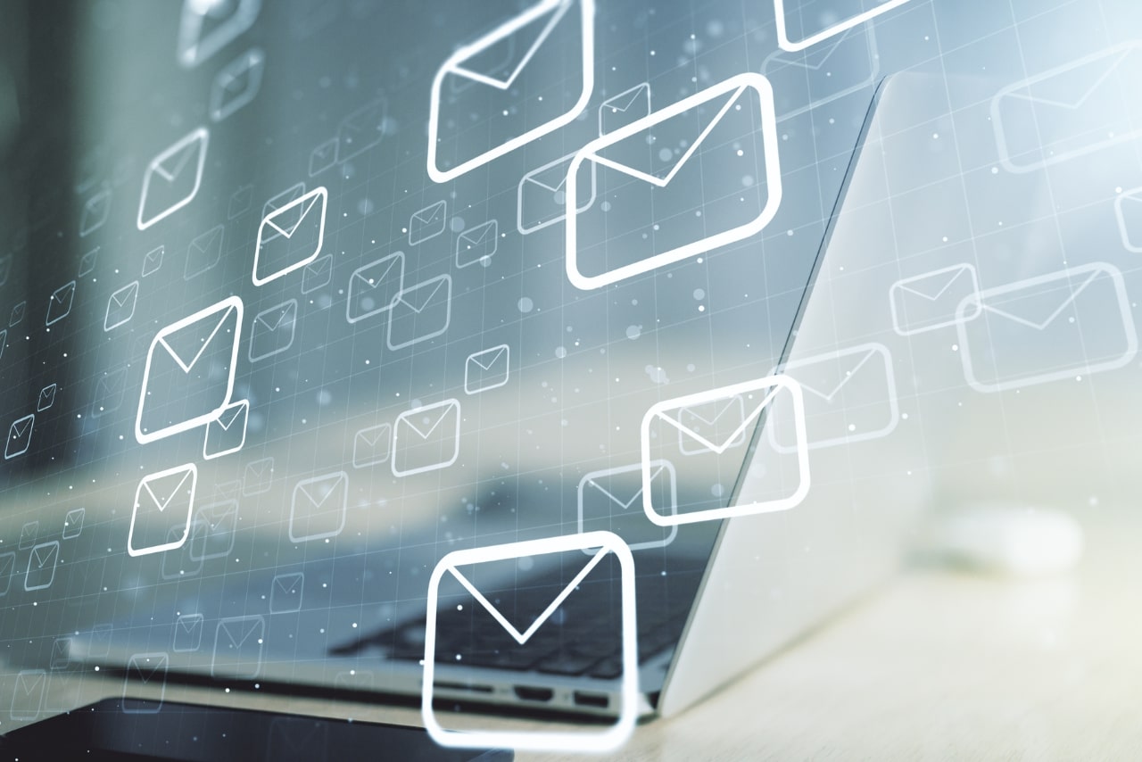 Creative abstract postal envelopes sketch on modern laptop background, e-mail and marketing concept. 