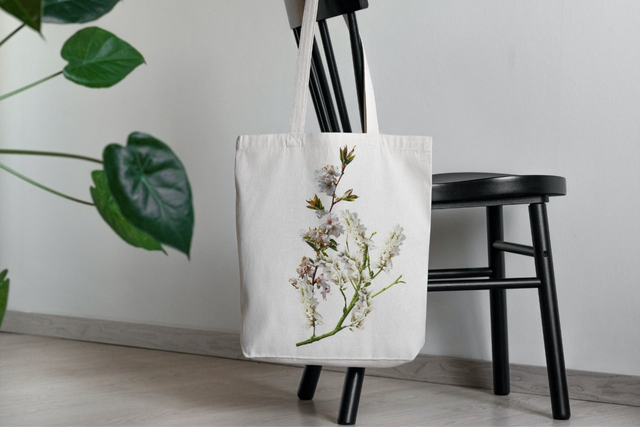 Custom-made Tote bag hanging on the chair.