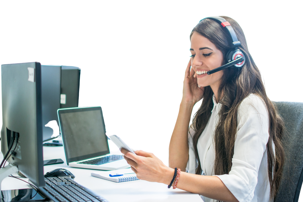 Friendly female customer support operator with headset using phone.