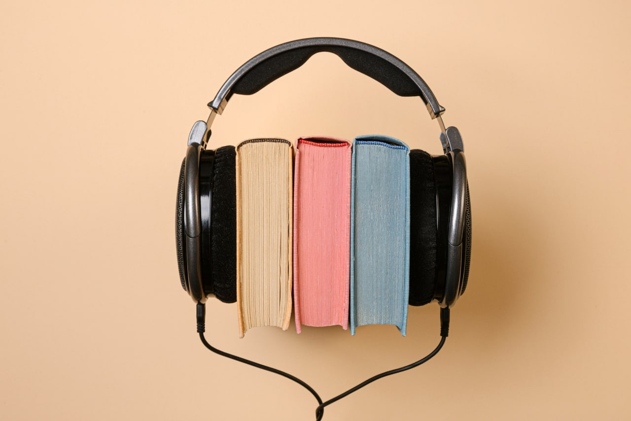Headphones on three books.