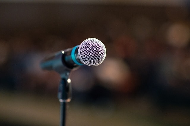 Image of microphone signifying public speaking.
