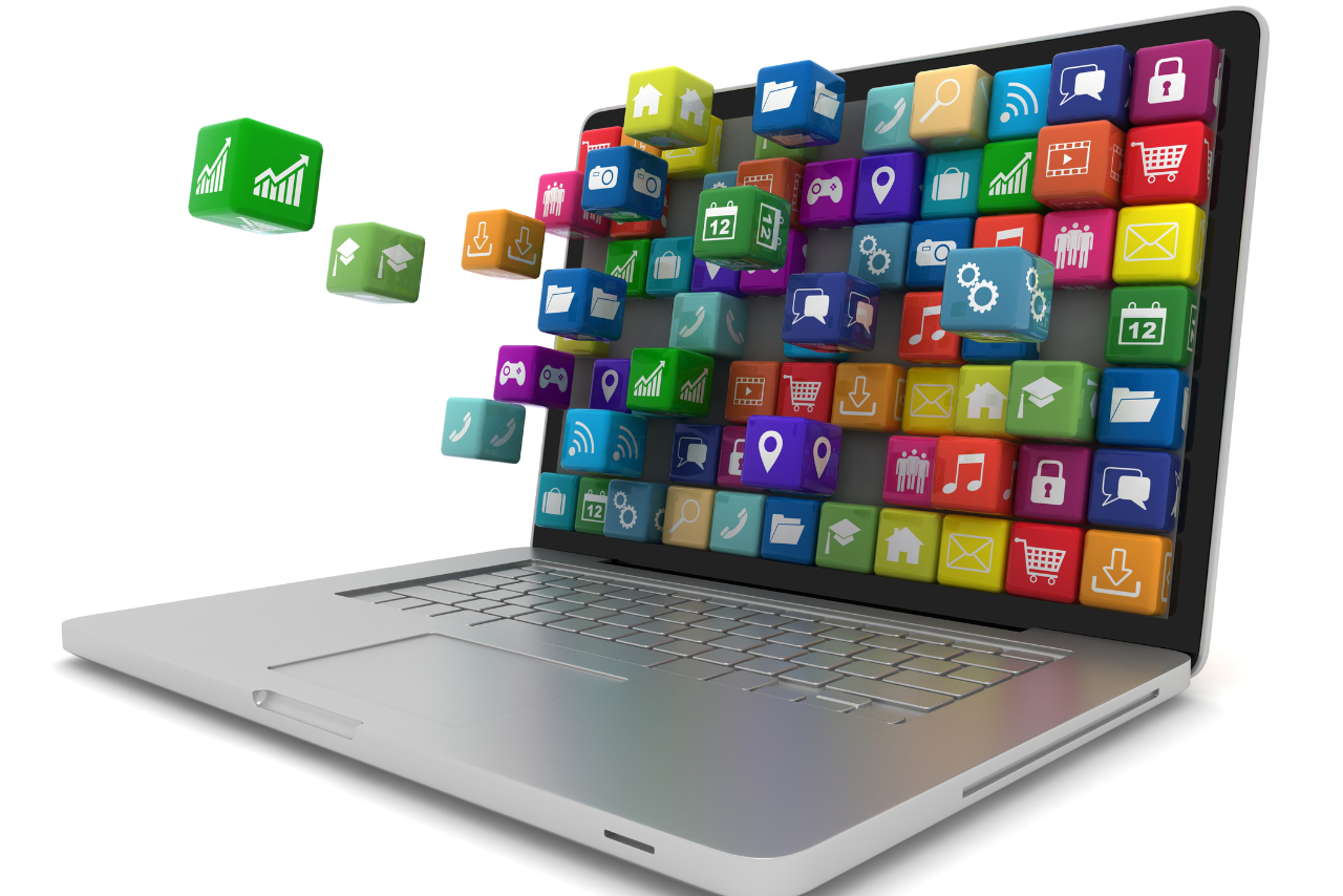 Laptop displaying many software icons.