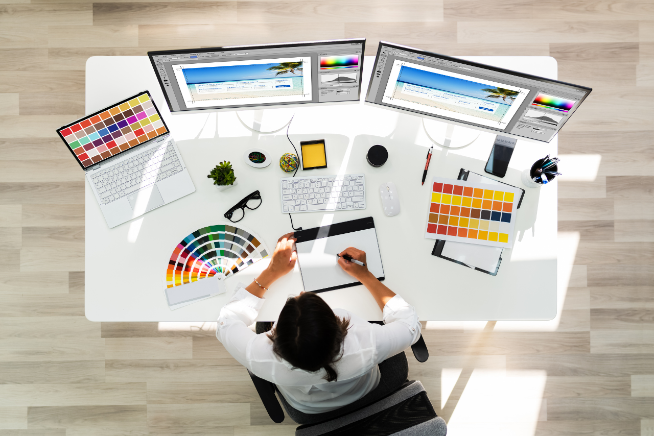 Man creating on graphic designs on his work table.
