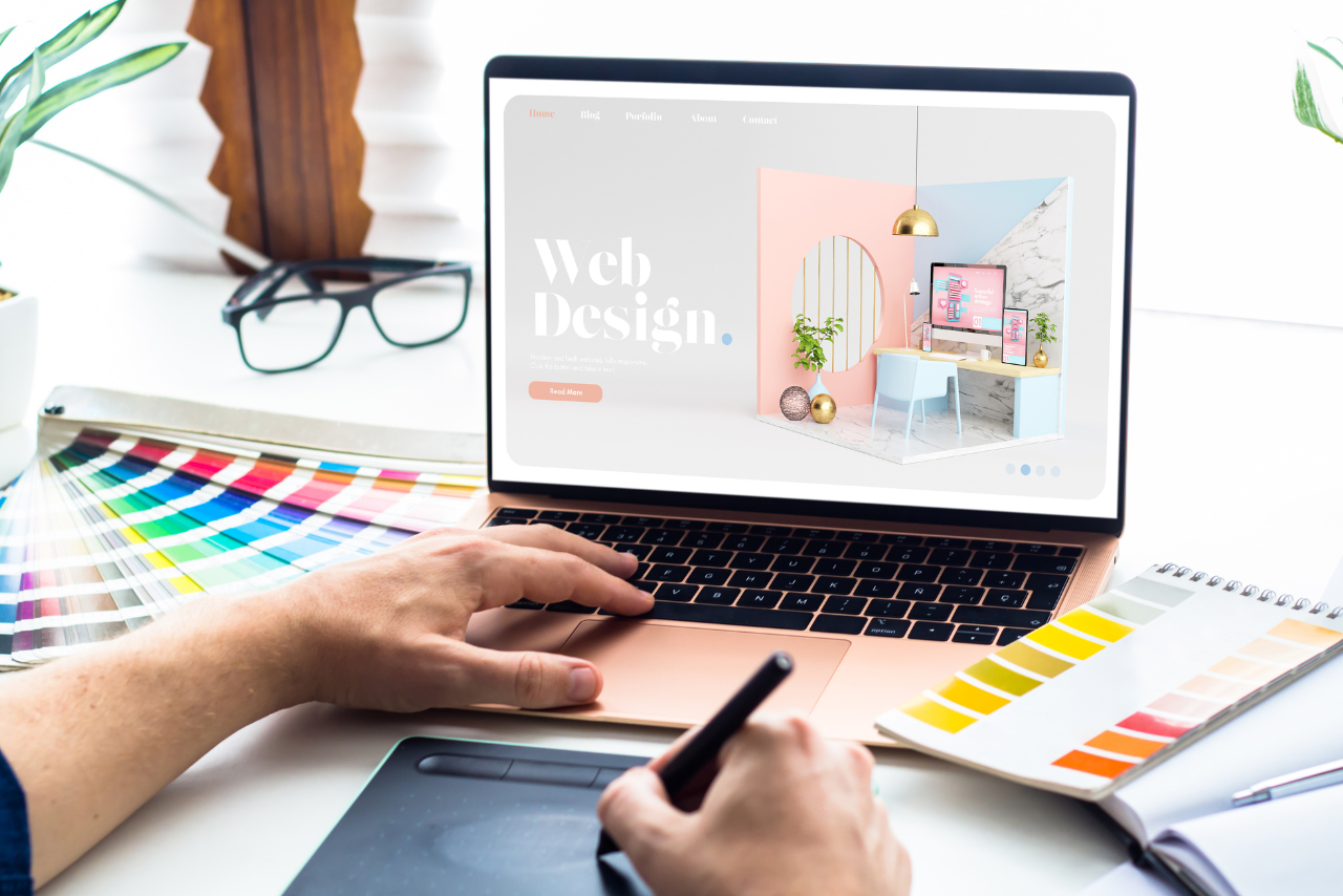 Man designing website using his laptop.