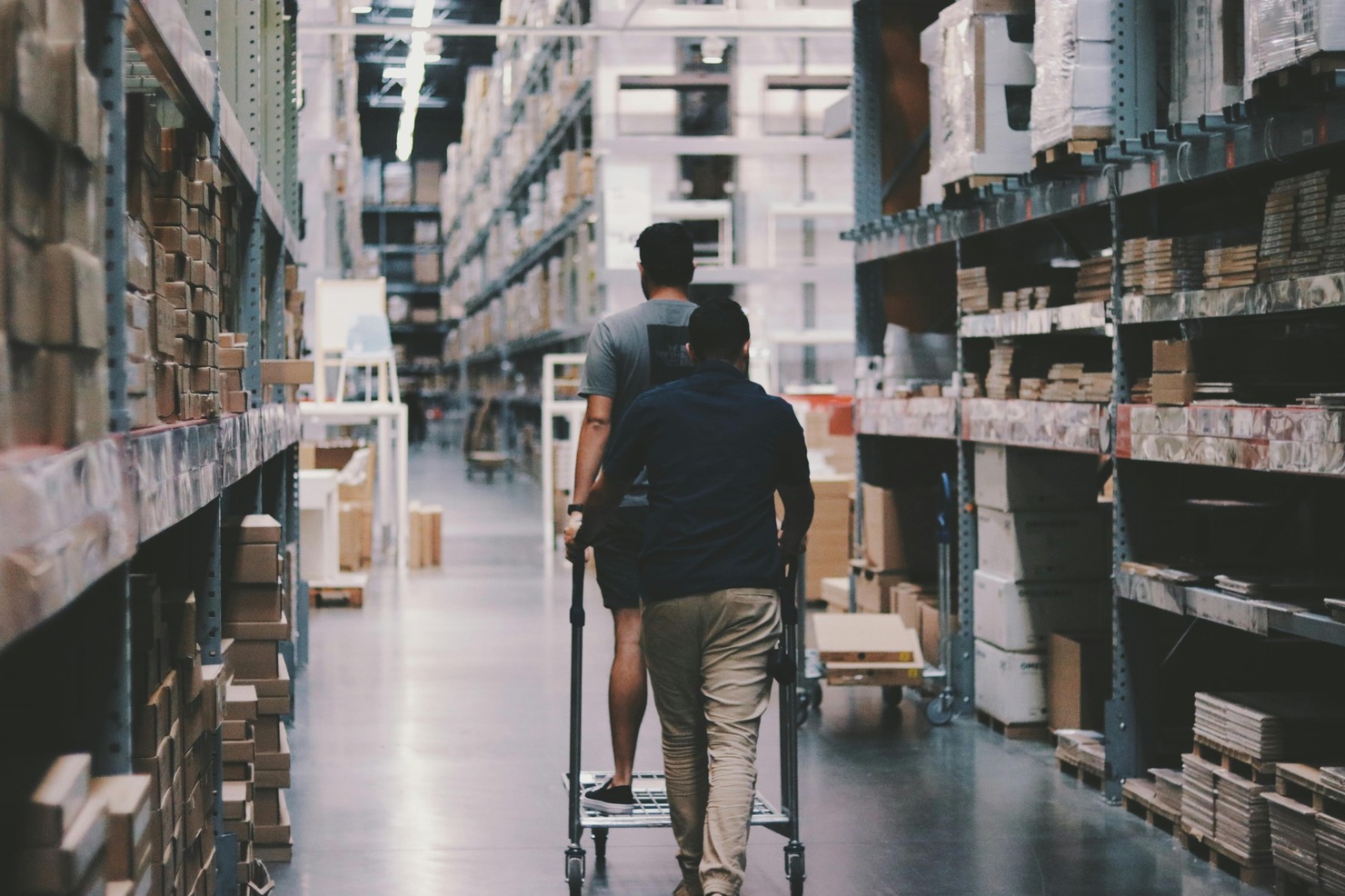 Men going around a warehouse.
