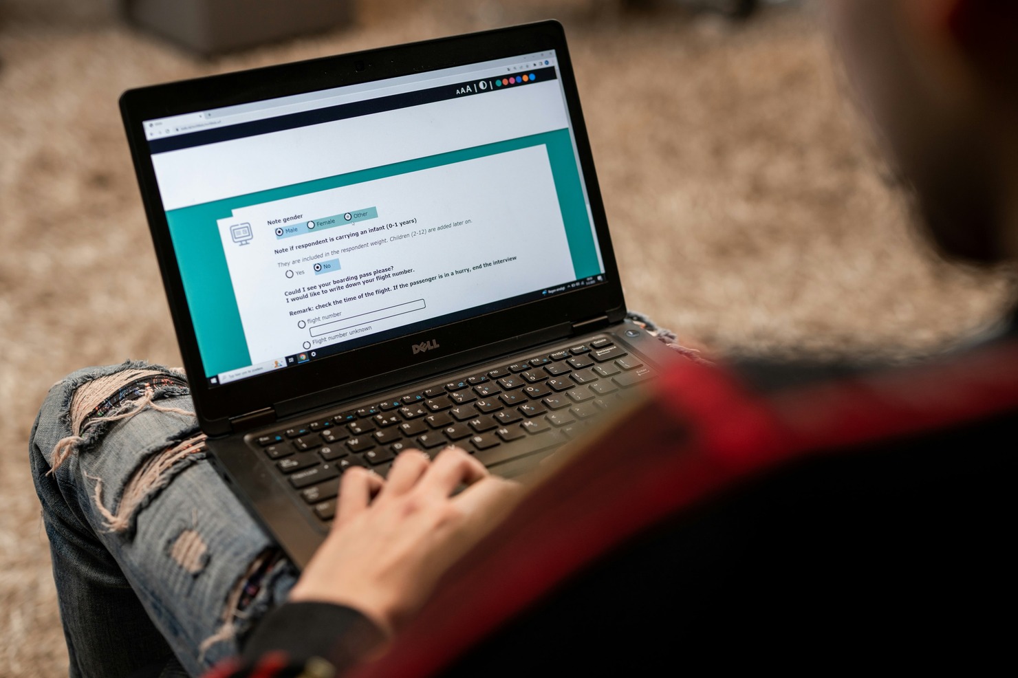 Online questionnaire displayed on a laptop.