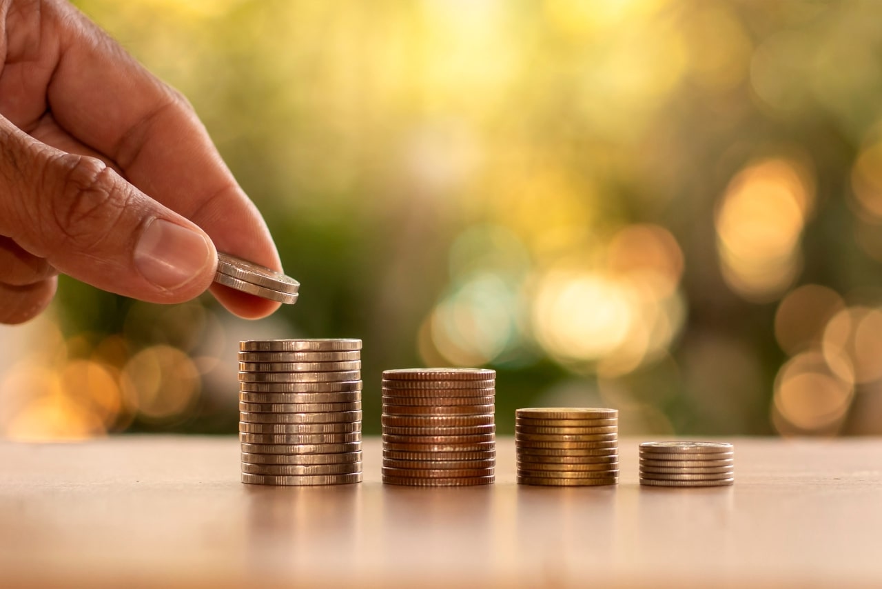 Person is Stacking Coins.