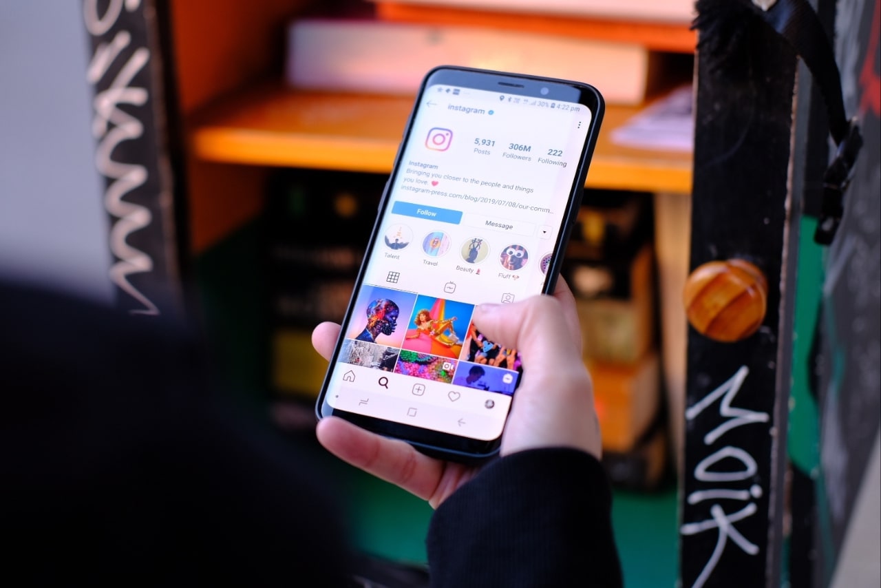 Person is viewing instagram account on phone.