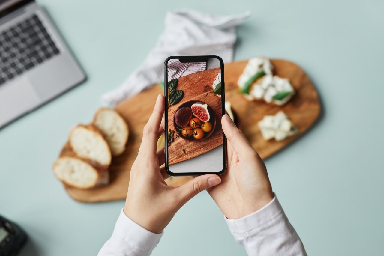 Taking a photo of food using smartphone.