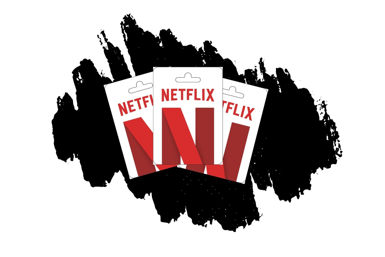 Three netflix gift cards with black scribble background.