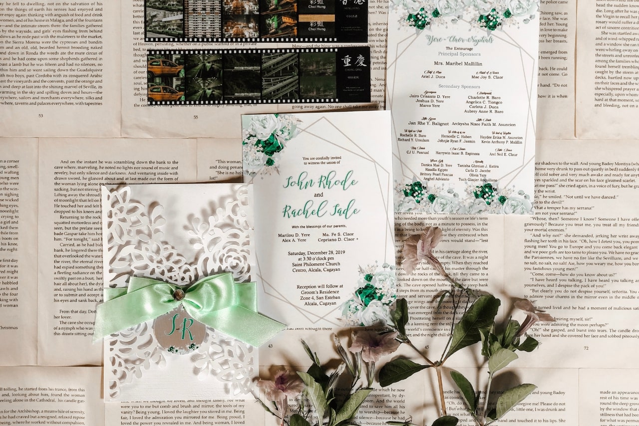 Wedding invitations on top of newspaper.