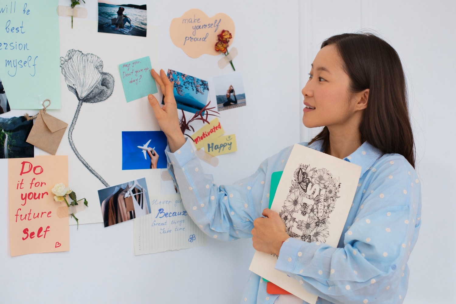 Woman creating her own vision board.