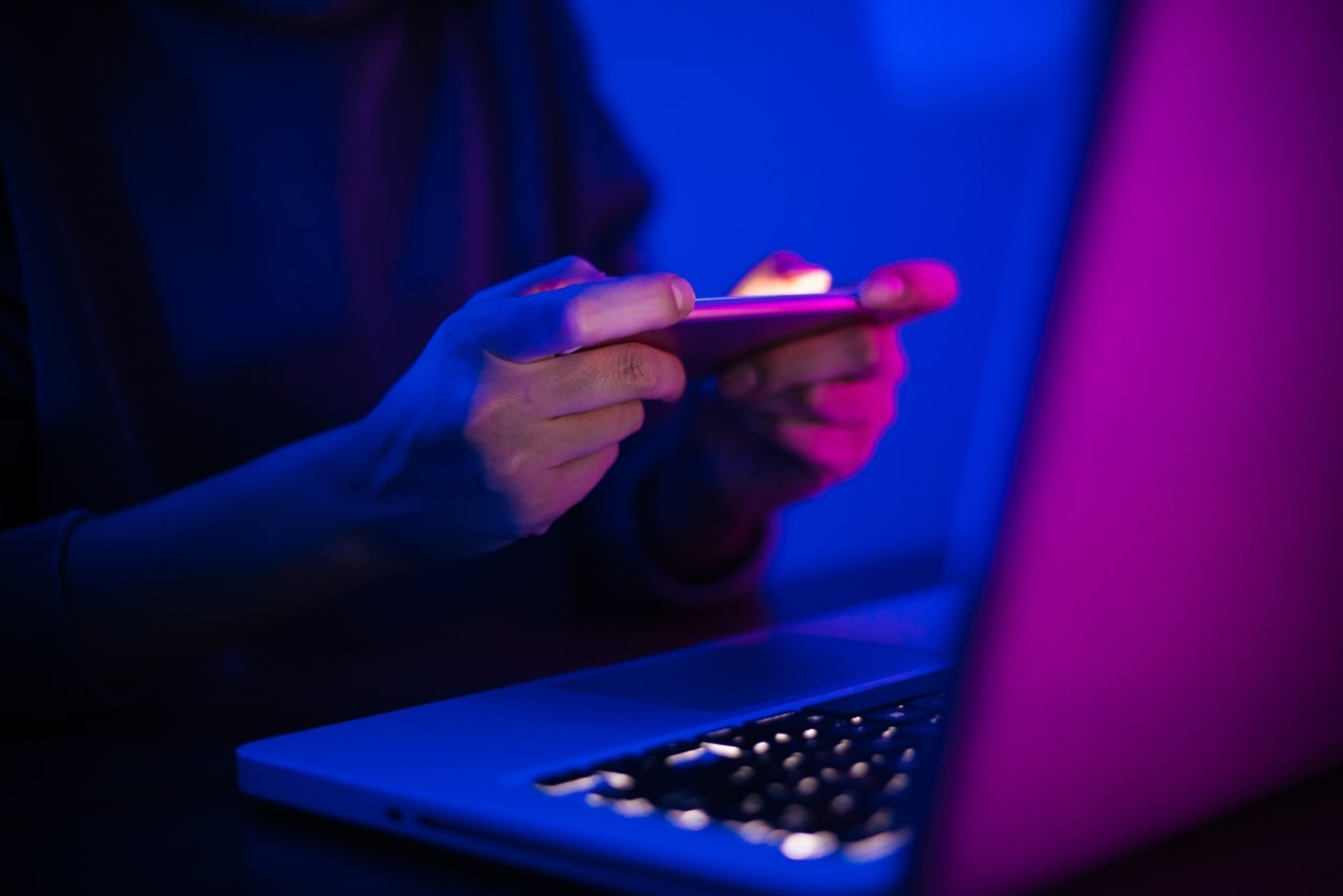 Young man playing mobile games.