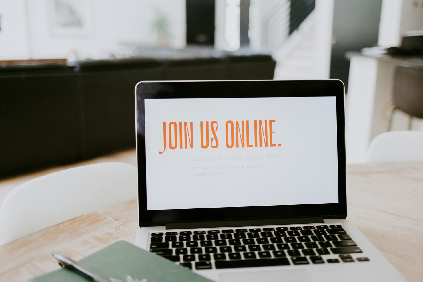 A laptop showing the Join us online text.