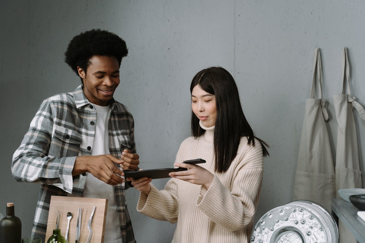 A man selling a product to a woman