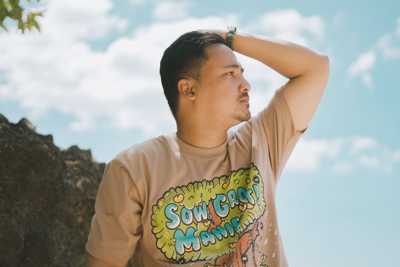 A man wearing a shirt with personalized print