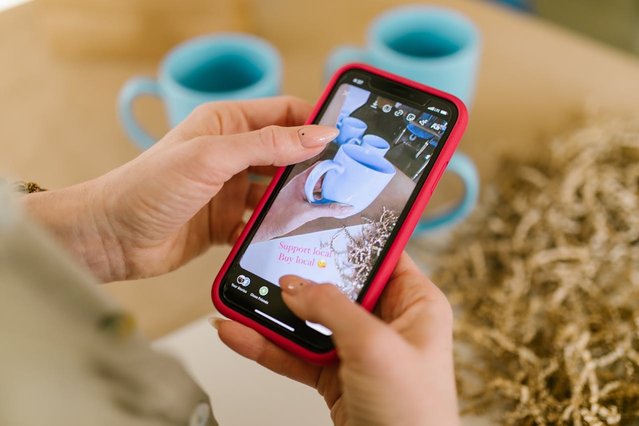 A person adding text to a product photo on a mobile phone