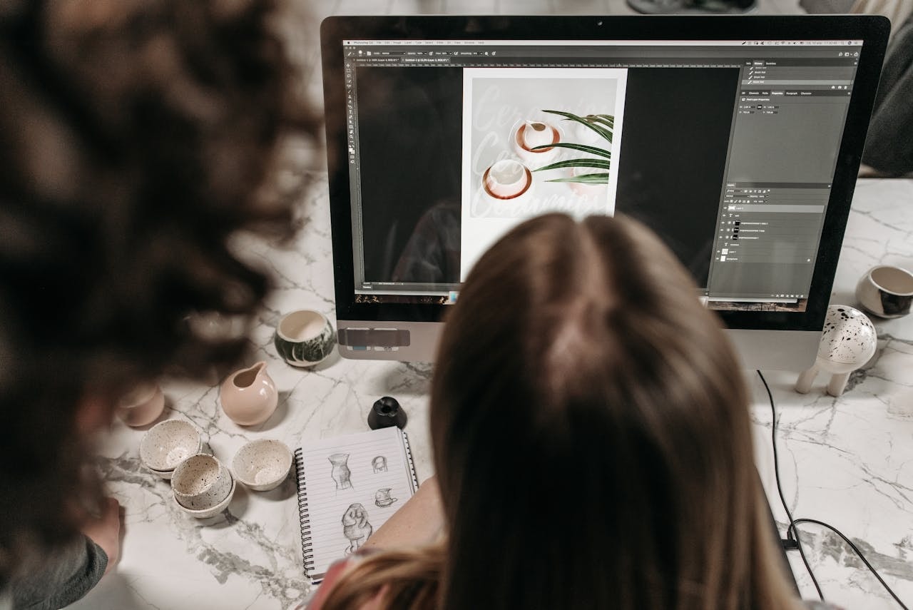 A person using a photo editing software on a computer