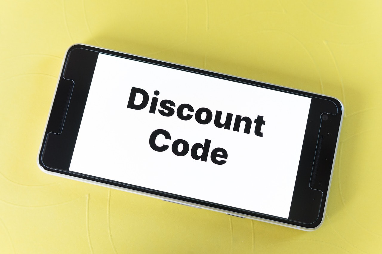 A phone with 'Discount Code' text.