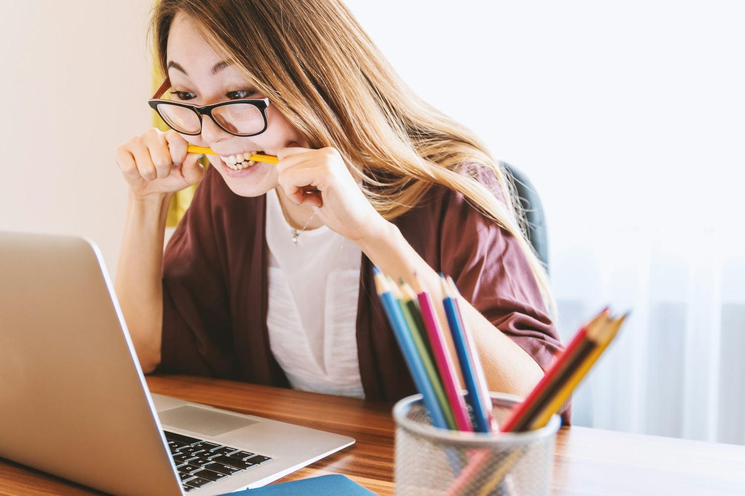 A woman concentrating on online studies.