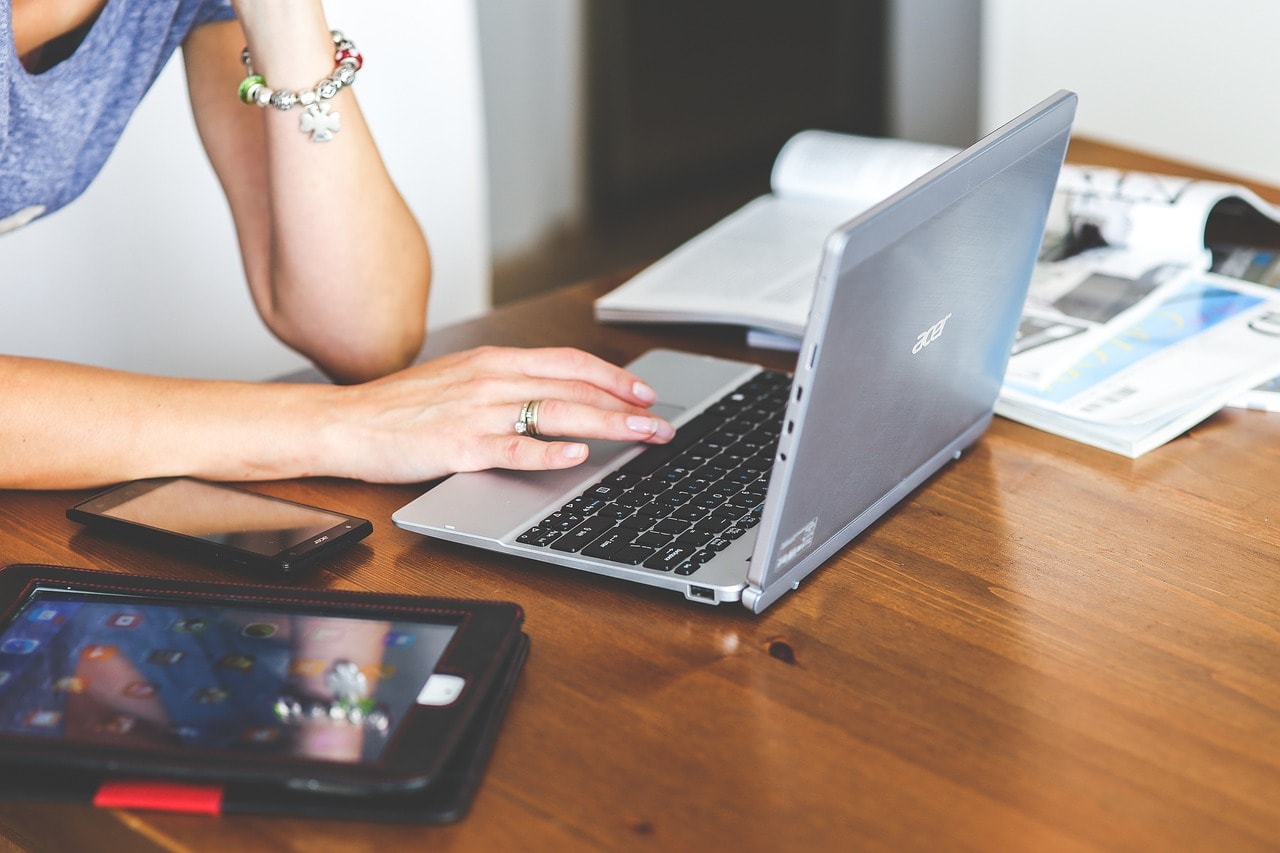 A woman on a laptop.