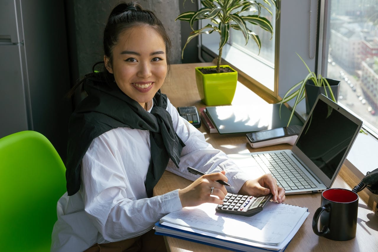 A woman using a calculator