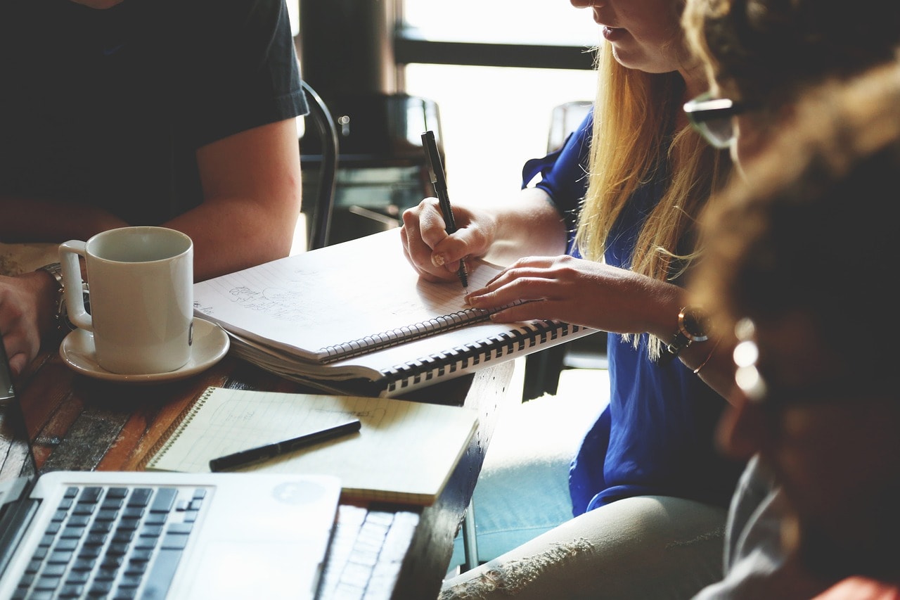 A woman writing a business plan.