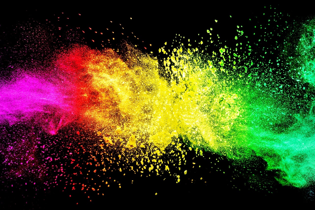 Abstract exploding in different colors on black background.