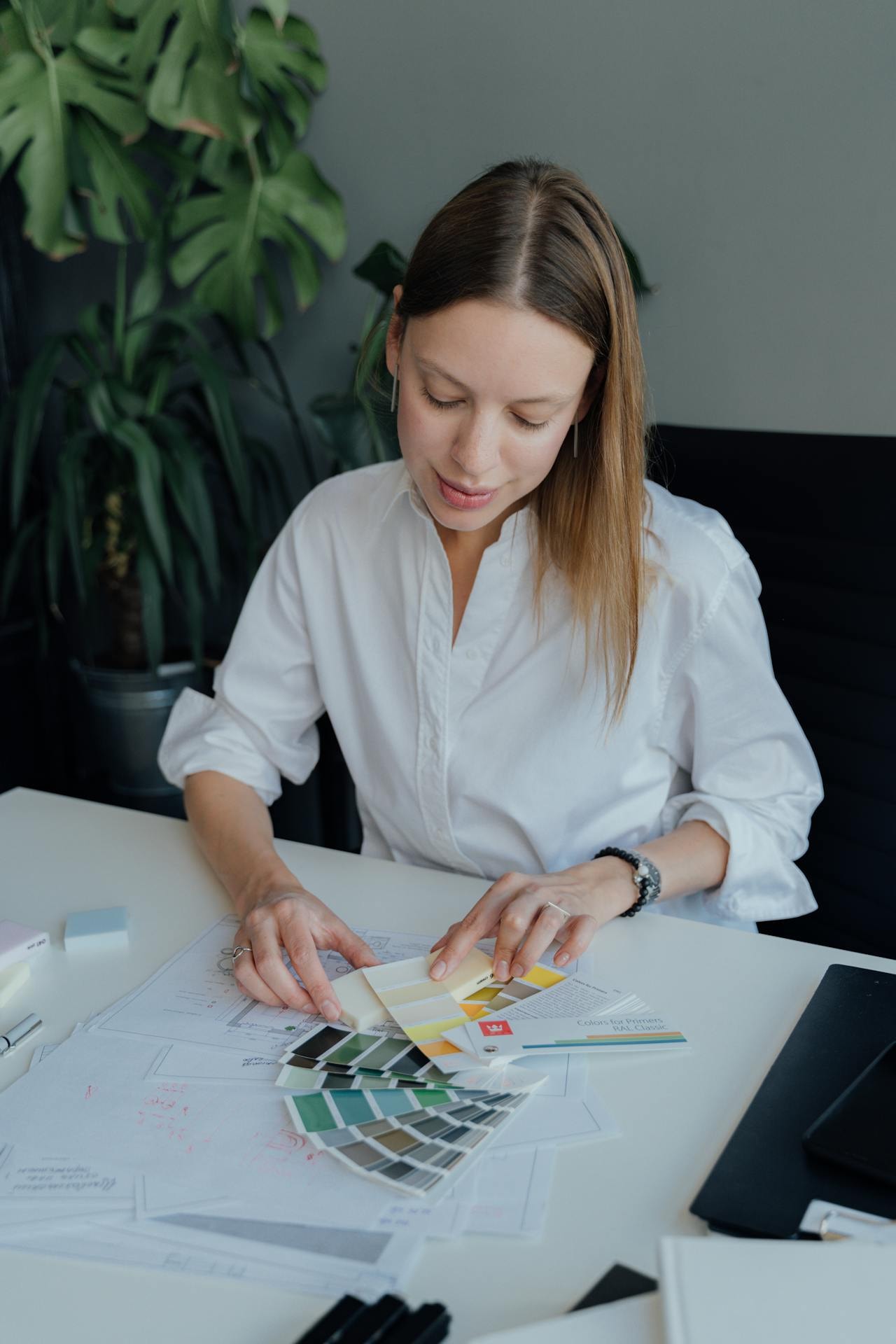 An interior designer looking at color palettes